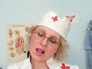 Impure Cougar in nurse uniform shows large whoppers